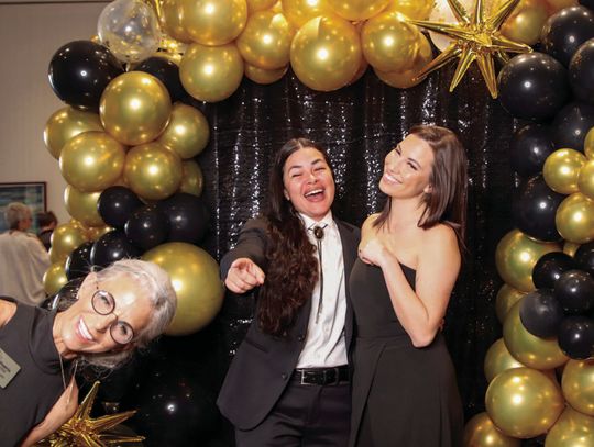 Patia Strickland (foreground, left) 'photobombed' her daughter Taylor Maanao and Lollie May Martin in the photo booth March 8 at the Phoenix Center Gala. Photos by Martelle Luedecke/Luedecke Photography