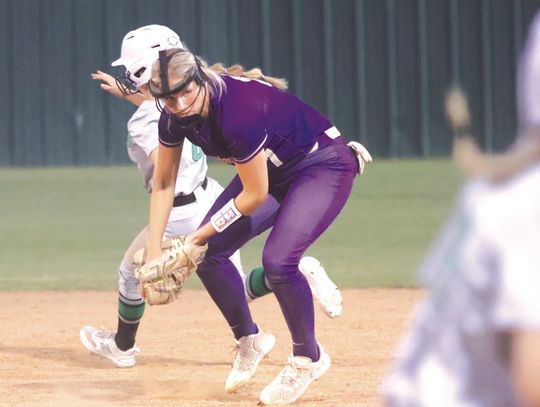Marble Falls senior second baseman Kylie Rob erts makes sure first base is covered before she digs the ball out of her glove for the sure out.