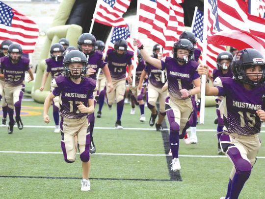 Marble Falls sixth-graders Van Michael (17), Easton Packer (1) and Zaymian Granadoz (15) run out of the tunnel to begin the playoffs. Find the game and more Sports on Pages 10, 11 and 12. Contributed photo