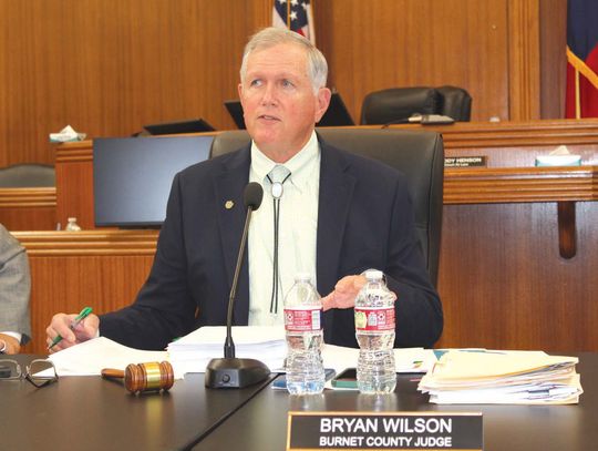 Burnet County Judge Bryan Wilson, pictured here reciting a resolution to oppose a rock quarry in Hoover's Valley, presided over the May 13 meeting. Raymond V. Whelan/The Highlander