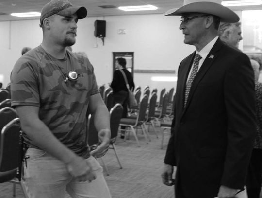 Devin Garkie (left) showed his support for Burnet County judge applicant Alan Trevino Feb. 6, during a county judge forum at the AgriLife Building.