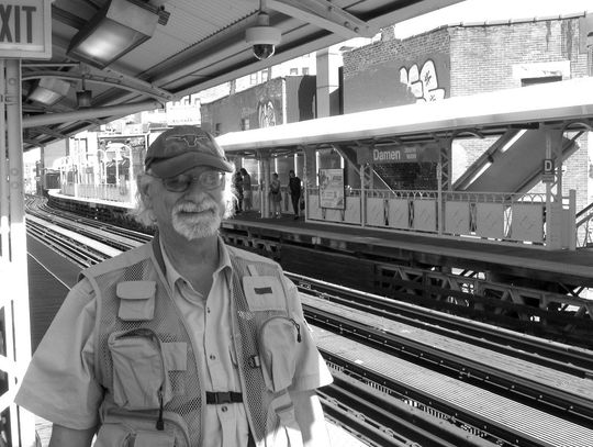 The Highlander staff writer Raymond V. Whelan, 'The Texan,' waits in Chicago at the Blue Line Damen Station for the 'L' train to the Loop (downtown Chicago). Contributed photo