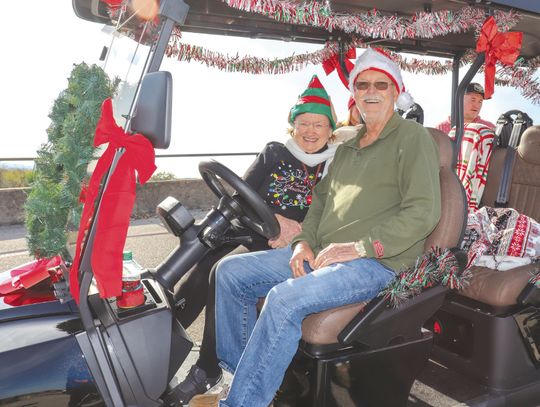 Granite Shoals residents Gail and Robert Monroe prepared for the Granite Shoals Christmas Golf Cart Parade. Find more photos on Page 8 Martelle Luedecke/Luedecke Photography