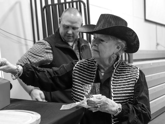 Sharon Lindahl placed her raffle ticket during the Highland Lakes Service League fundraiser Chuck Wagon Chow Down in 2024. Next year's event is Jan. 25. Martelle Luedecke/Luedecke Photography