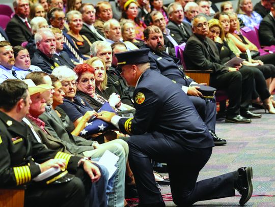 Community mourns at fallen fire chief 's memorial