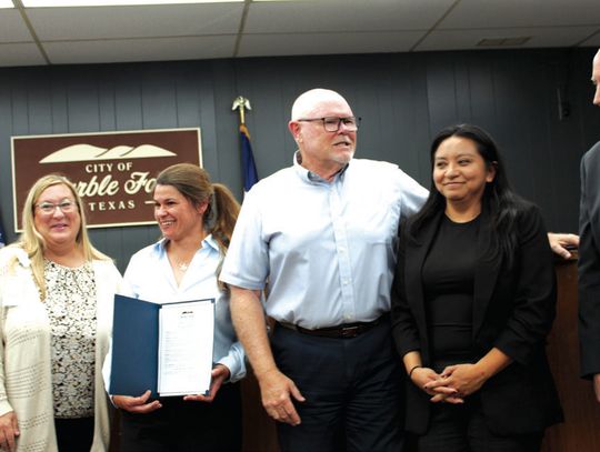 Marble Falls City Council proclaimed May 4-10 as Pub- lic Service Recognition Week during its May 6 meet - ing. Pictured, from left, are Highland Lakes Regional Emergency Communication Center Director Stacy Baker Marberry, Parks and Recreation Director Lacey Dingman, Mayor Dave Rhodes, Dev...