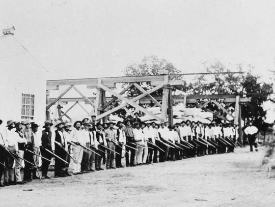 This undated photograph is of the guards at Granite Mountain Quarry taken in front of the convict quarters in background. Contributed photo/Austin History Center