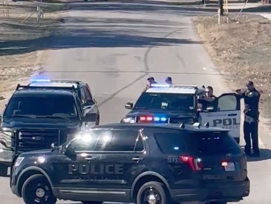 Marble Falls police swarmed a vehicle Jan. 16 just around 2:30 p.m. with weapons drawn on Second Street, west of Avenue N. The suspect, in his 50s, eventually surrendered about an hour an half later following a tense standoff. Contributed/Haley Booe