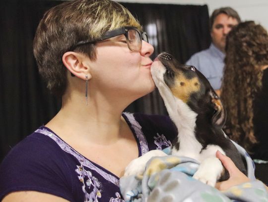 Saturday, April 27 at the Highland Lakes YMCA in Burnet at the Wags to Riches fundraiser Julia Nedbaleck received a kiss from the live auction puppy which raised $700 for Hill Country Humane Society. Photos by Martelle Luedecke/Luedecke Photography