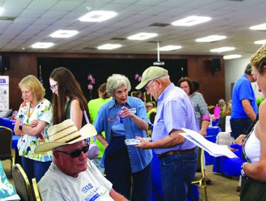 Fairgoers filled the exhibit hall, taking time to admire the wide variety of displays at the Burnet County Area Fair. Photos by Martelle Luedecke/Luedecke Photography