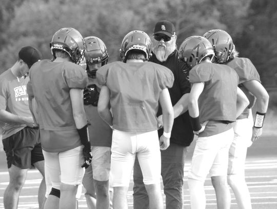 Faith Academy head coach Jay Silvers gathers with the offense. Jennifer Fierro/TexasChalkTalk.com