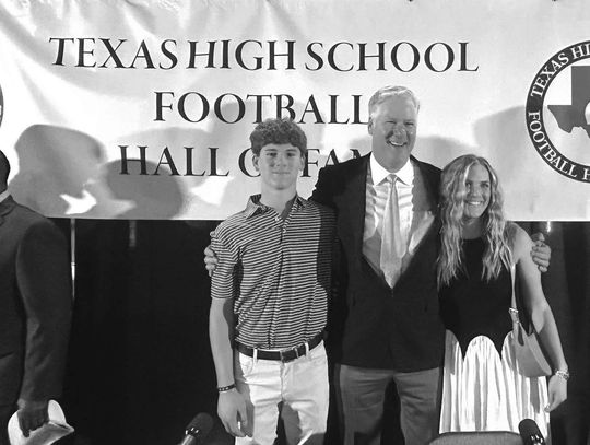 Contributed photos Brad Goebel took a moment out of the ceremony for candids with his son Gage and daughter Kylie.