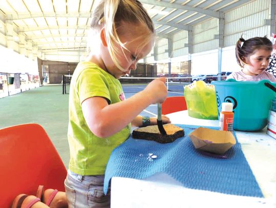 Little Harmony Kennedy (left) and Davina Torres painted granite at the 2022 GraniteFest. More family-friendly activities are on tap for this Saturday's event in Granite Shoals. File photo