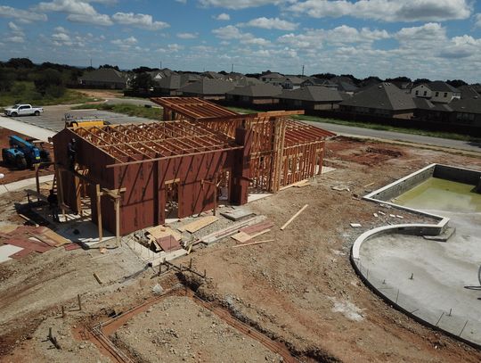 Construction has begun on the community center at Gregg Ranch with resident-focused features including a main swimming pool with lap lanes, a gathering space, multiple shade ramadas, and game courts.