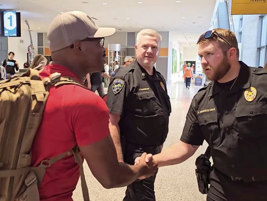 Contributed photo Granite Shoals Police Officer Cory Jones (left) greeted fellow Officer Dustin Schuetz at the airport in Austin. Capt. Chad Taliaferro (center) was among officers who welcomed him home.