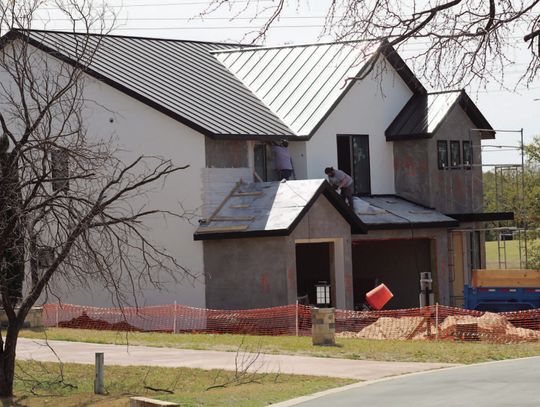 File photo A group of contractors get the work done on a home under construction on Rio in Horseshoe Bay. The city is hosting a meeting for builders to learn about new regulations.