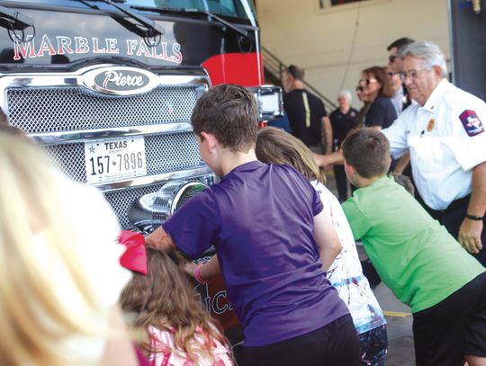 Residents of all ages assisted in the fire truck push-in ceremony June 4 at the Marble Falls Fire Rescue station. Photos by Martelle Luedecke/Luedecke Photography
