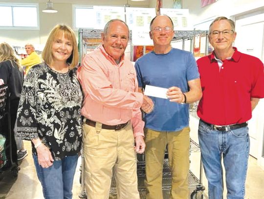 From left, The Helping Center administrative assistant Carol Hall, Rotarian Gil Jones, The Helping Center board president Paul King and Executive Director Sam Pearce gathered for a $1,000 check pre sentation recently made possible by the Marble Falls Daybreak Rotary Club. Contributed photo