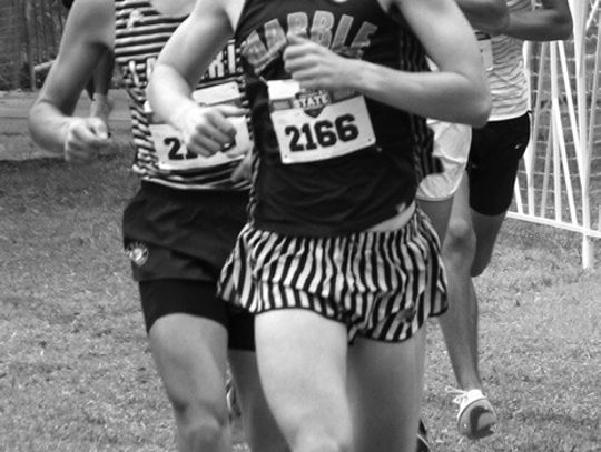 Martelle Luedecke/Luedecke Photography Marble Falls senior Tyler Hamblin eyes the final meters of the Class 4A state race.