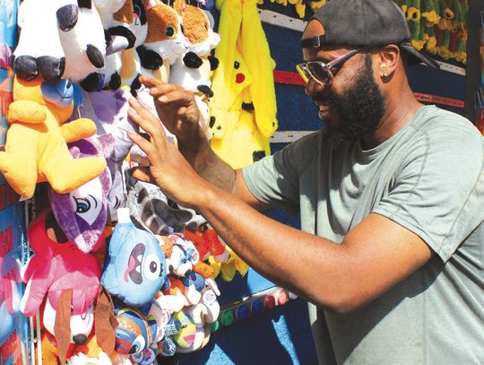 Photos by Connie Swinney/ The Highlander Charlie Alexander of Kerrville was among the crew April 30 preparing the MayFest carnival in Johnson Park in Marble Falls. The traveling midway, which coincides with FiestaJAM in the park, is going on today, Friday, May 2 and Saturday, May 3..