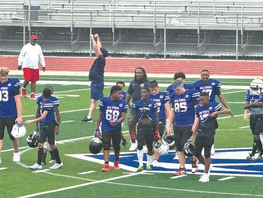 Marble Falls Middle School athlete Quincy Rodriguez (68) walks and talks with his teammates after the win. Contributed photos