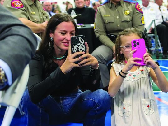 'Yay Daddy' was the cheer from Morgan and Emily Randolph, when Troop - er Franklin Randolph's name was called to accept his award March 6 during the Hill Country 100 Club Awards Banquet at the YMCA of the Highland Lakes.
