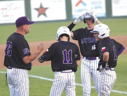 Head coach Tyler Porter (left) talks to Grant Carter (11), Braxton Dicken (1) and Owen Nash.