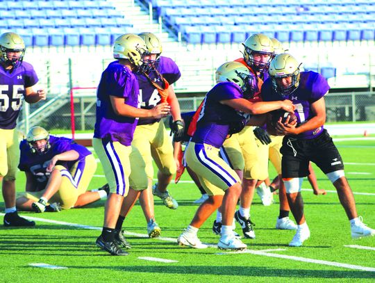 Marble Falls High School junior running back Jonathan Hernandez looks for running room and protects the ball during practice Aug. 9. Photos by Jennifer Fierro/TexasChalkTalk.com