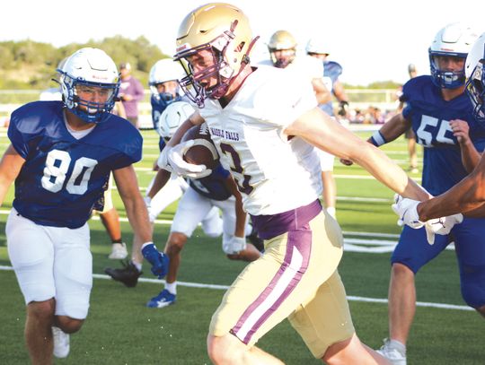 Marble Falls senior receiver Parker Phillips runs for a first down during the scrimmage against Lago Vista Aug. 15.