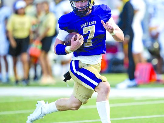 Marble Falls junior quarterback Doak Timmerman is on his way to score one of his many touchdowns against Austin Crockett. Contributed/Stennis Shotts