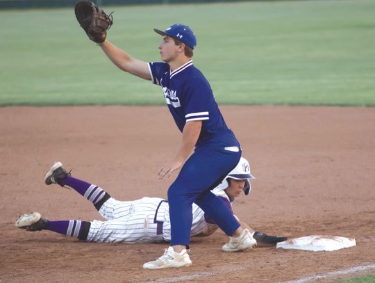 Marble Falls sophomore John Alan Whittle gets dirty as he dives to get back to first base and avoid the tag. The dirt is part of having natural grass at Scearce Field. Whittle's father, Marble Falls In dependent School District Assistant Superintendent of Administration Stan Whittle, playe...