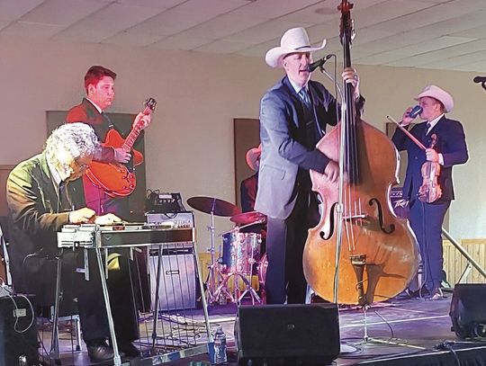 Jake Hooker and the Outsiders kept the crowd on their feet at the recent Joseph's Hammer fundraiser for the women's prison chapel in Burnet. Contributed photos/Pam Stevenson