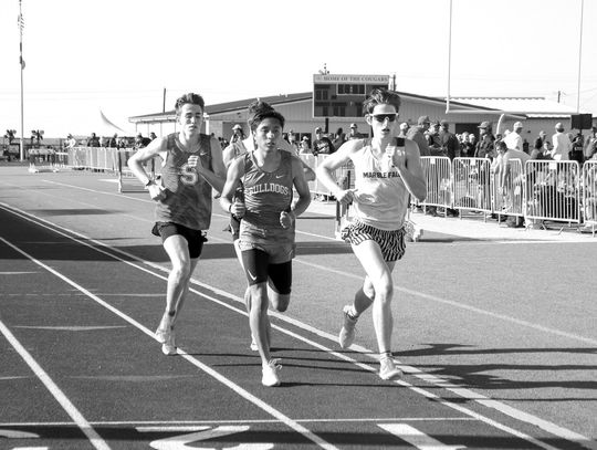 Seniors Victor Aviles of Burnet (middle) and Tyler Hamblin of Marble Falls run their way back to the Class 4A Region III meet thanks to finishing in the top four of the middle-distance races at the District 23 and 24-4A area meet.