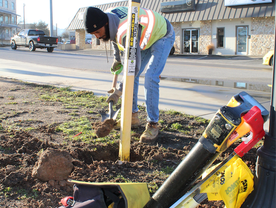 Atmos personnel works on an area after a thaw, during past frigid weather in Marble Falls. File photo