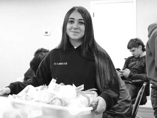 Ava Aguillar carried a box of completed baby bottles during her service Feb 14 at Pregnancy and Life Center in Kingsland. Photos by Martelle Luedecke/Luedecke Photography