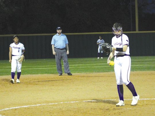 Marble Falls pitcher Camille Catalfamo checks her wristband after reading the sign from the catcher to know what pitch to throw. Photos by Jennifer Fierro/TexasChalkTalk.com