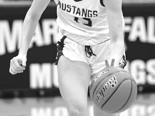 Senior guard Kenadie Cotton and the Lady Mustangs continue battling in a challenging District 24-4A.
