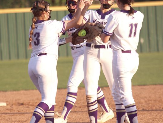 Freshman pitcher Brooklyn Damico (3) congratulates senior second baseman Kylie Roberts for catching a line drive for an out as senior first baseman Sophia Biagii (11) and freshman shortstop Callie Phillips join them.