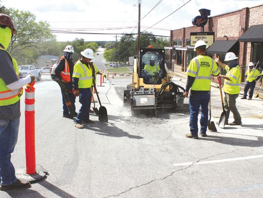 Connie Swinney/ The Highlander Crews launched into parking lot work in the 900 block of Third Street on Aug. 14. Visitors to downtown will begin to see upgrades and improvements to parking, streets and sidewalks this year.