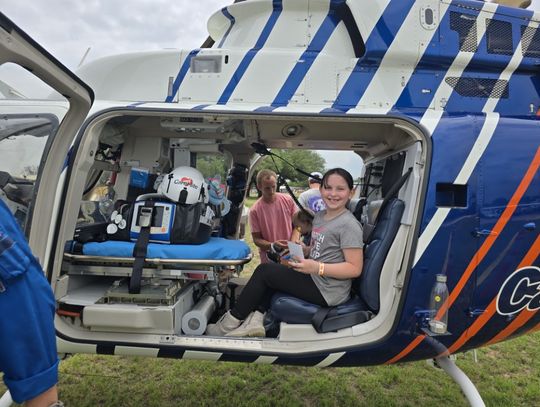 Kingsland School student Aria enjoyed an imaginary ride in the skies from the seat of a helicopter April 26 at the Toucha- Truck fundraiser for the Boys &amp; Girls Club in Kingsland.