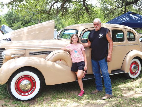 Natalie Pearson posed with her grandfather in front of their 1937 Buick Roadmaster entry. Photos by Martelle Luedecke/Luedecke Photography
