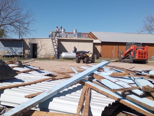 A crew began picking up the pieces March 5 after wind gusts swept the roof off Hoover's Valley Store, 7203 Park Road 4, just outside of Kingsland. Photos by Beverly Walker/The Highlander