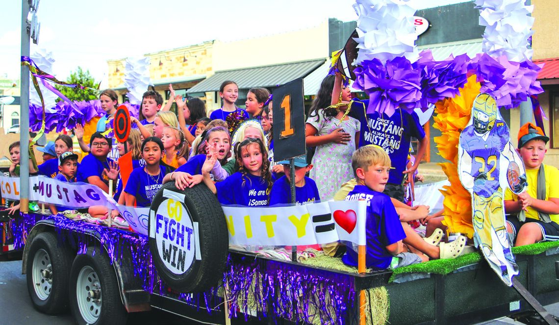 Colt Elementary float was filled with students cheering the Mustangs Sept. 9 at the Homecoming Parade on Main Street.