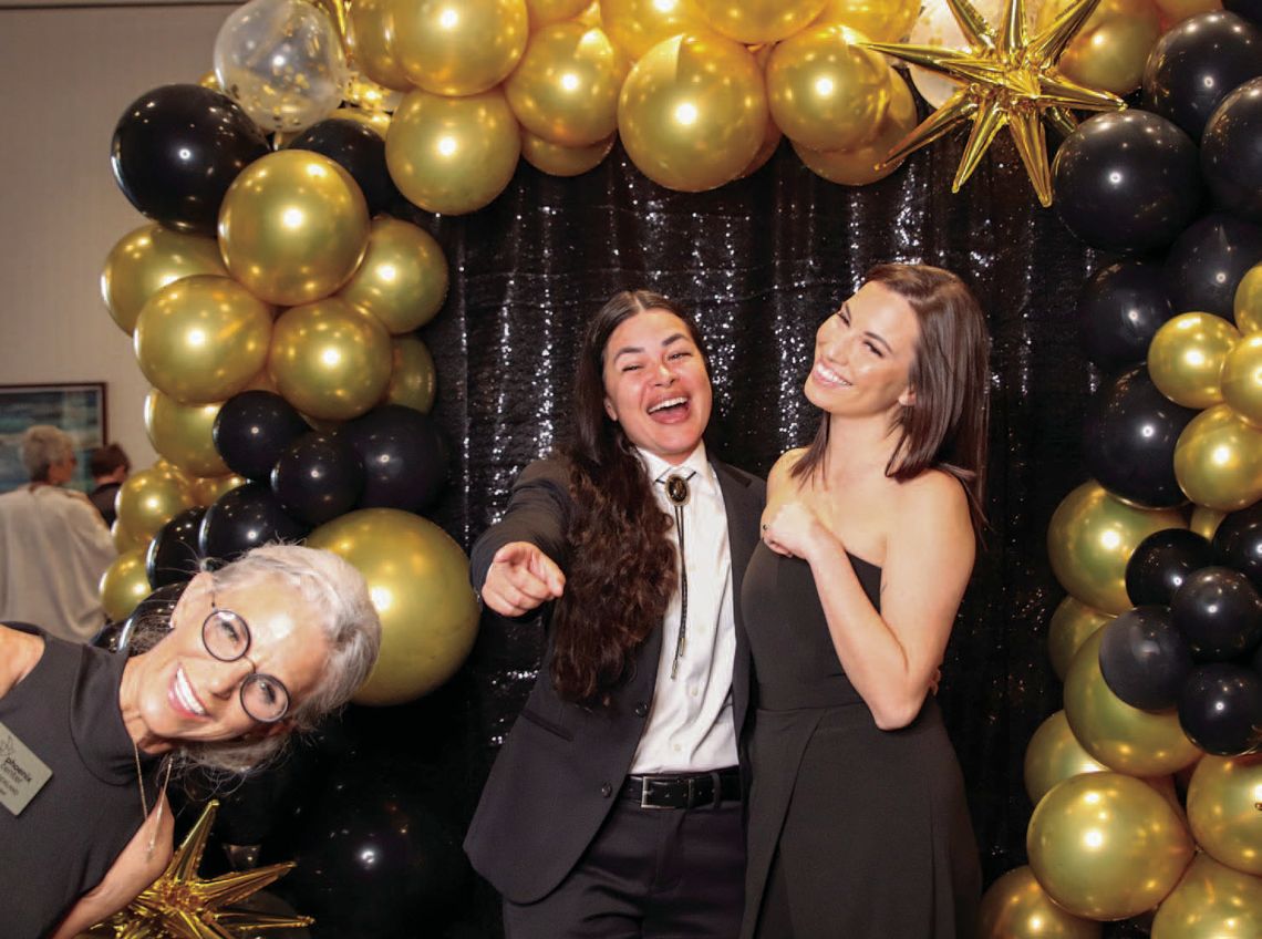 Patia Strickland (foreground, left) 'photobombed' her daughter Taylor Maanao and Lollie May Martin in the photo booth March 8 at the Phoenix Center Gala. Photos by Martelle Luedecke/Luedecke Photography