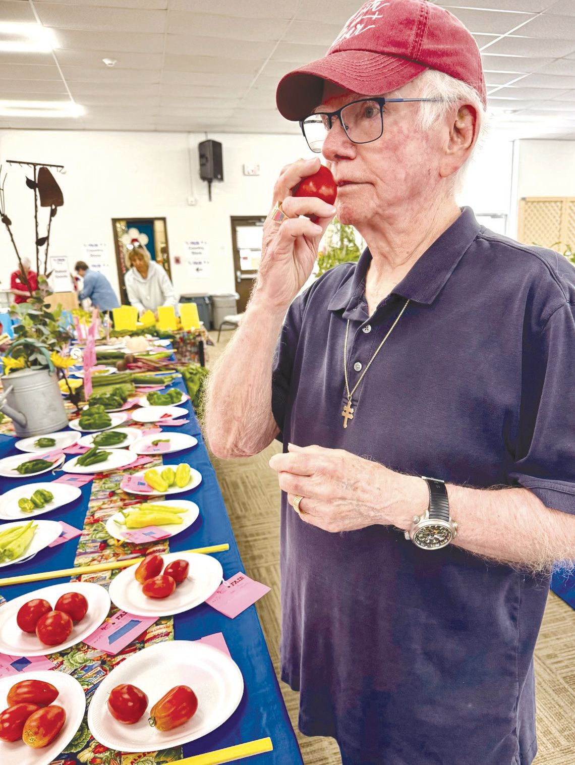 Bill Luedecke applies all his horticultural knowledge and good taste while judging tomatoes for the Burnet County Fair. The public is invited to tour the event Friday and Saturday. Find more details Inside. Martelle Luedecke/Luedecke Photography