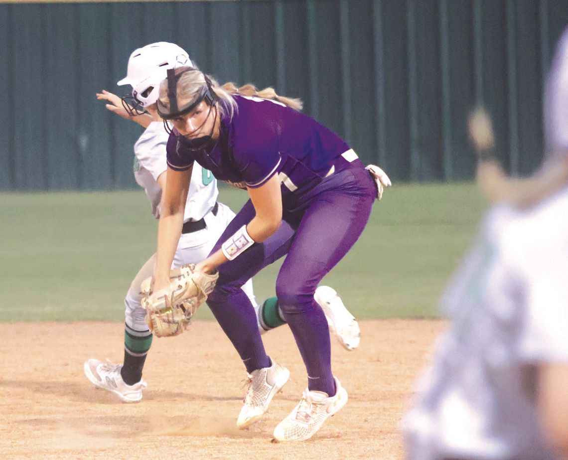 Marble Falls senior second baseman Kylie Rob erts makes sure first base is covered before she digs the ball out of her glove for the sure out.