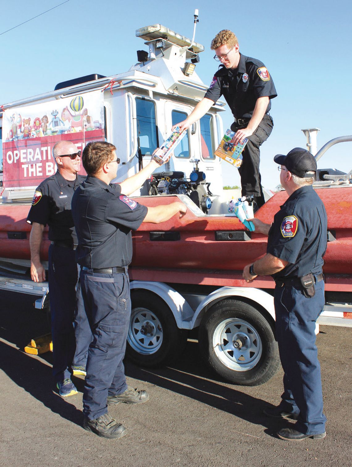 Granite Shoals Fire Department assists with collection of donated toys for the Christmas Outreach effort. Pictured, from left, are Lt. Joshua Nugent, Nick Mokry, Nick Ballard and Lt. David Short. Connie Swinney/The Highlander