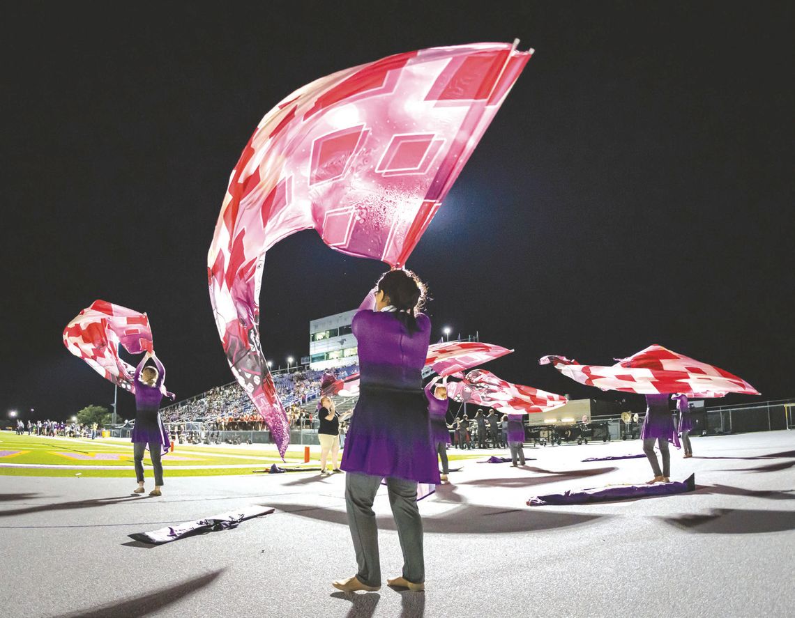 The color guard made a colorful splash, during a Marble Falls Mustangs home game. The band program would benefit if voters approve a proposition for renovations and a new facility. Contributed/ Ralph Arvesen Photography