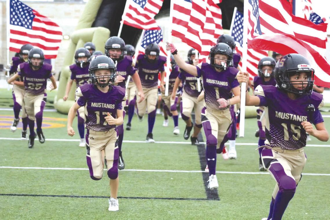 Boys of Fall Marble Falls sixth-graders Van Michael (17), Easton Packer (1) and Zaymian Granadoz (15) run out of the tunnel to begin the playoffs. Find the game and more Sports on Pages 10, 11 and 12. Contributed photo