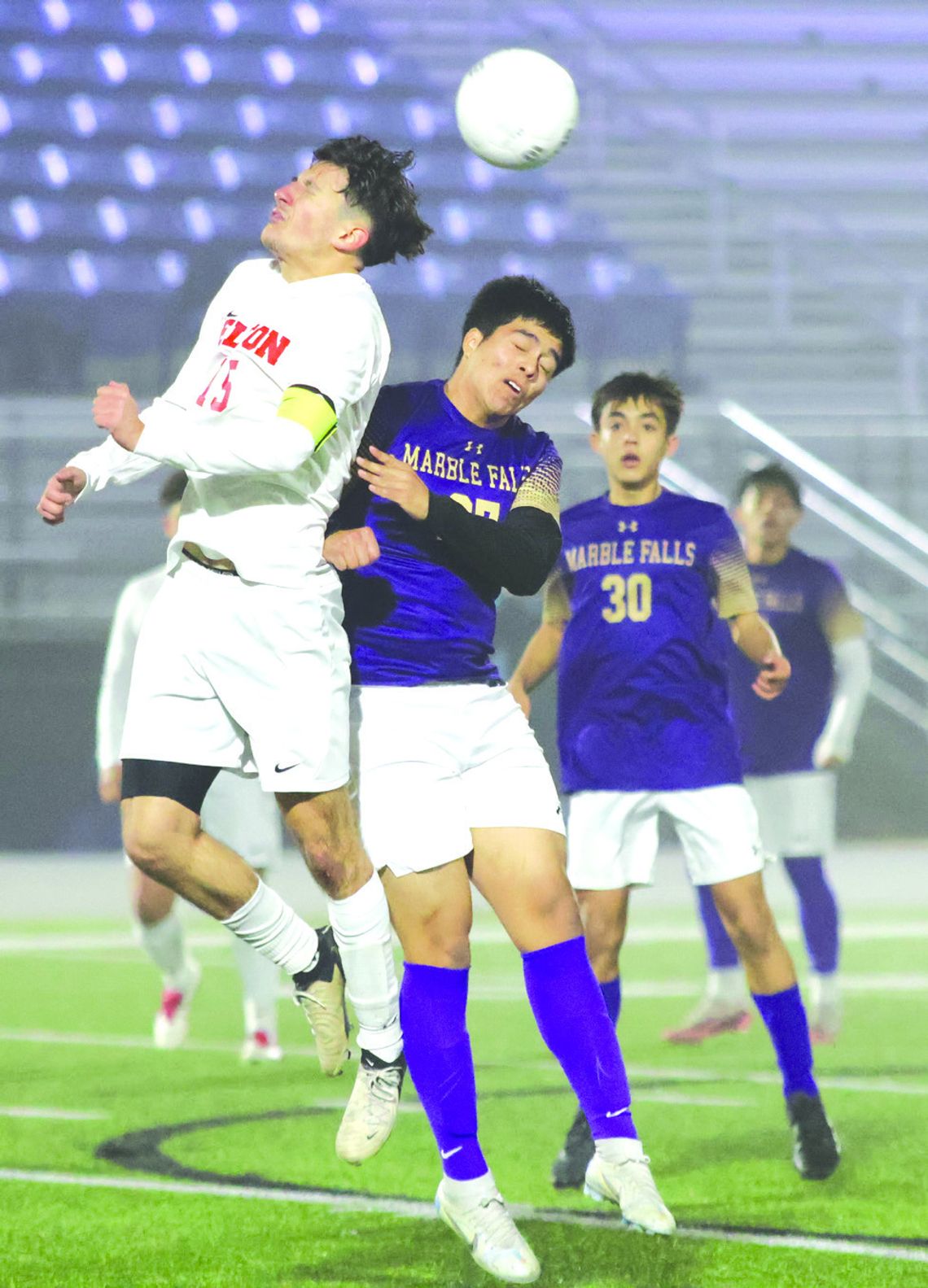 Marble Falls senior Jordan Guzman protects himself as Belton senior Josue Reyes Trejo uses his head to get the ball to the other side of the field. Photos by Jennifer Fierro/TexasChalkTalk.com